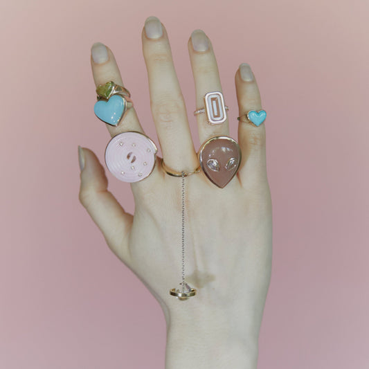 Signature-alien-ring-yellow-gold-with-orange-moonstone-and-diamond